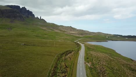 Coastal-road-in-western-Scottish-Highlands,-aerial-landscape-view