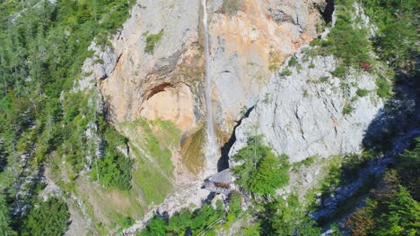 Aerial-shot-flying-towards-Rinka-waterfall,-a-famous-hiking-destination-in-Logar-Valley,-Slovenia