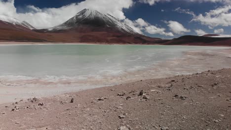 snow-capped-volcano-with-blue-lake-in-bolivia