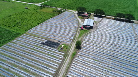 Wide-Pull-Out-Aerial-Shot-Of-A-Large-Country-Side-Farm