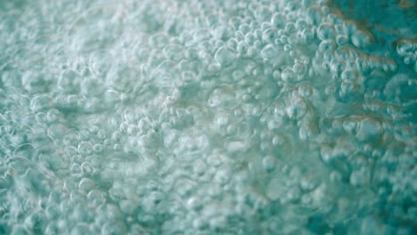 Close-up-view-of-water-bubbles-on-a-flowing-fresh-water-surface