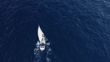 topdown-shot-of-a-sailboat-from-a-drone