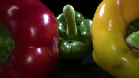 Red,-green-and-yellow-bell-peppers-outwards-macro-shot