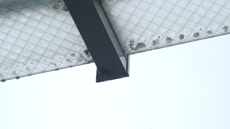 Rain-Dripping-From-The-Glass-Roof-During-Rainy-Season-In-Tokyo,-Japan