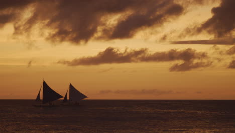 Slow-Motion-Panning-Shot-Of-Boracay-Beach-And-Sail-Boats-In-Silhouette