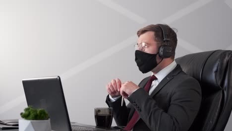 man-in-medical-mask-and-business-suit-ponders-idea