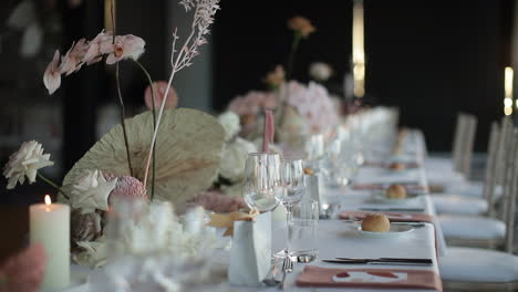 closeup-of-elegantly-decorated-long-dining-table-at-reception