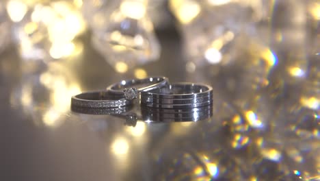 Wedding-rings-isolated-on-a-sparkling-background-with-a-prism-effect
