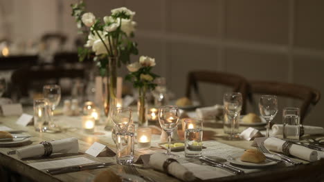elegant-dinner-setting-illuminated-with-candels