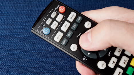 Pressing-the-TV-channel-up-button-on-the-tv-remote-control
