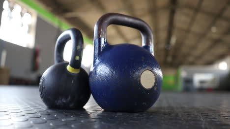 panning-footage-of-kettlebells-on-a-gym-floor
