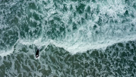 Areial:-Surfer-bodyboarding-waves-in-Llandudno