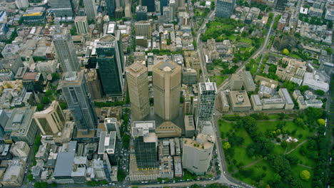 Melbourne-CBD-top-down-helicopter-aerial-Flinders-St-tracks-Treasury-Gardens-and-Collins-Place
