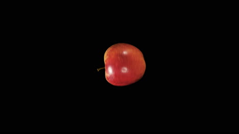 Red-Apple-Spinning-On-A-Black-Background