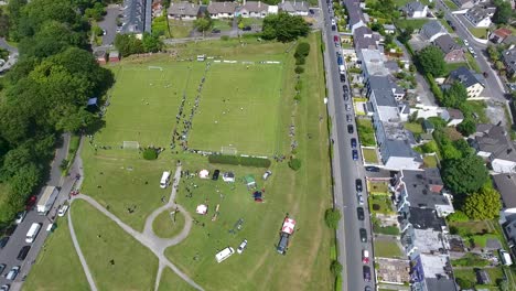 Drone-Shot-of-Two-Outdoor-Soccer-Football-Games-in-Galway-City,-Ireland,-Panning-Left
