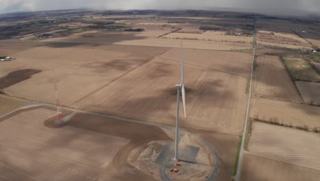 Top-down-view-of-a-massive-wind-turbine-and-cell-phone-tower