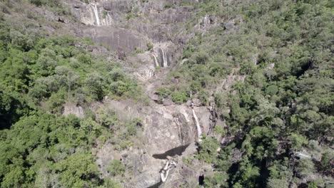 Jourama-Falls-And-Series-Of-Cascades-At-Paluma-Range-National-Park-Fringed-By-Rainforest-In-Summer-In-Yuruga,-QLD,-Australia