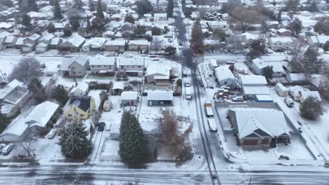 Soaring-drone-shot-over-neighborhoods-covered-with-fresh-snow