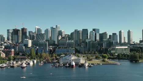 Aerial-view-rising-up-from-Lake-Union-to-reveal-downtown-Seattle-on-a-bright-summer-day