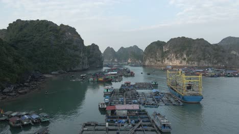 Low-aerial-flyover:-Floating-Vietnamese-fishing-village-in-La-Han-Bay