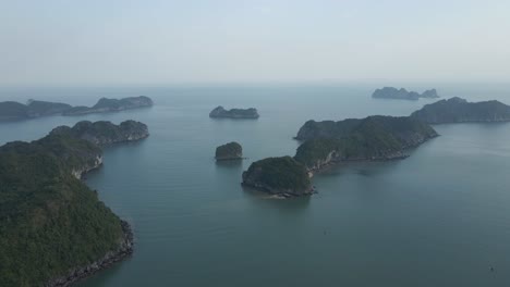 Aerial-pan:-Outer-rocky-jungle-islands-in-Ha-Long-Bay-in-Vietnam