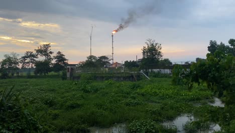 -View-Of-Kailashtilla-Gas-Field-Plant-Seen-Burning-Orange-Flame-In-Background