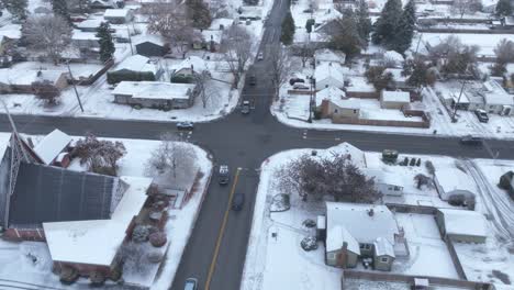 Aerial-view-of-a-busy-intersection-surrounding-by-snow-on-the-ground