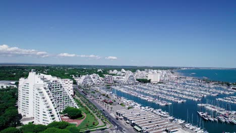 Aerial-dolly-shot-over-the-seafront-resorts-looking-down-onto-the-Feu-de-la-jetée-Est