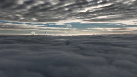 Abstract-aerial-view-between-dark-gray-layers-of-clouds-with-blue-sky-between-for-a-very-moody-look
