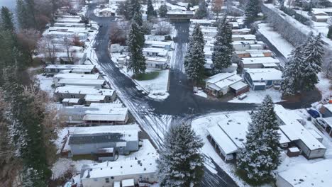 Drone-shot-of-a-mobile-home-park-covered-in-snow
