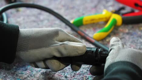 Electrician-preparing-an-extension-cable-