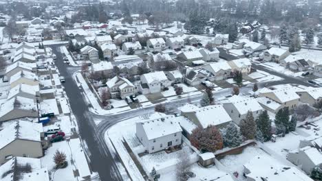 Drone-shot-of-an-American-neighborhood-covered-in-snow