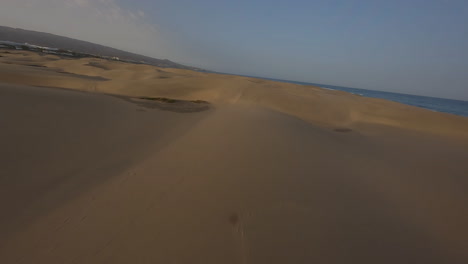 Aerial-flying-over-sand-dunes-in-Maspalomas-at-beautiful-sunset