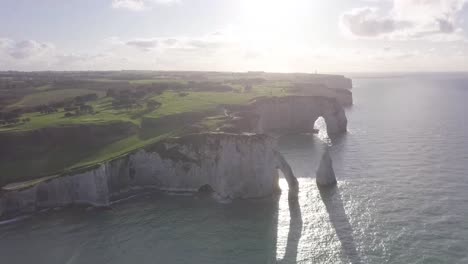 Aerial-drone-shot-of-Etretat-along-the-seaside-cliffs-in-Normandy-at-Northern-France