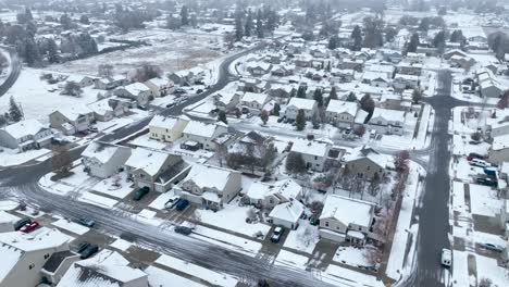 Wide-aerial-view-of-an-American-neighborhood-covered-in-snow