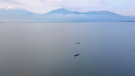 Aerial-view:-Group-of-fishing-boats-on-lake-catching-fish-for-Business-in-Asia