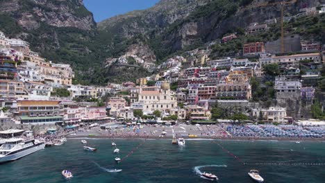 Drone-shot,-push-out-from-the-beach-of-Positano,Italy