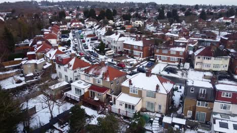 Establishing-drone-shot-suburban-town-in-England-with-snow-in-winter