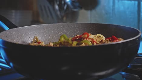 Wok-filled-with-meat-and-vegetables-being-cooked-for-homemade-mexican-food