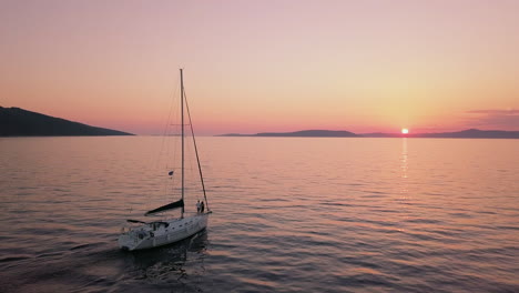 Aerial-4k-Sailing-Boat-At-The-Sea-Sunset