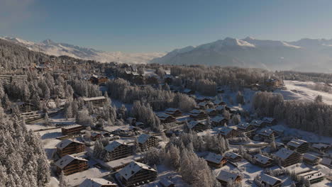 Aerial-shot-in-Switzerland-over-the-town-of-Crans-Montana,-Valais