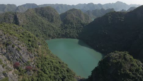 Shallow-lake-lagoon-on-steep-rocky-island-in-Ha-Long-Bay-in-Vietnam