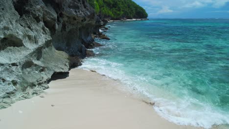Men-on-the-beautiful-beach-in-Bali-island,-Indonesia