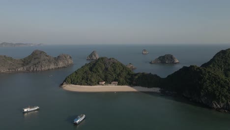 Tour-boats-and-fishing-boats-share-mooring-in-Ha-Long-Bay,-Vietnam