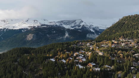 Aerial-shot-in-Switzerland-over-the-town-of-Crans-Montana,-Valais