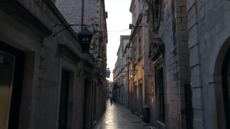 Moving-through-an-Ally-in-Old-town-Dubrovnik-at-sunrise