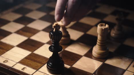 Fingers-move-queen-to-checkmate-and-lay-down-king-on-chessboard,-close-up