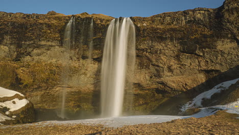 Beautiful-Seljalandsfoss-Waterfall-In-South-Iceland-On-A-Sunny-Day