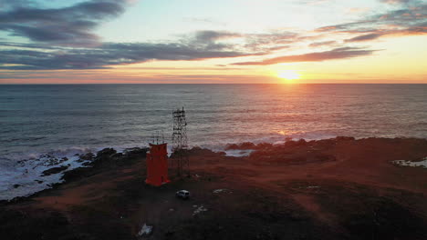 Glorious-Sunset-Scenery-By-The-Hvalnes-Lighthouse-In-Southeast-Iceland---wide-drone-shot