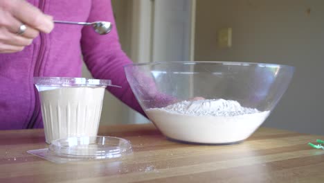 Adding-Yeast-to-Big-Bowl-of-Ingredients---Slow-Motion-Making-Scones